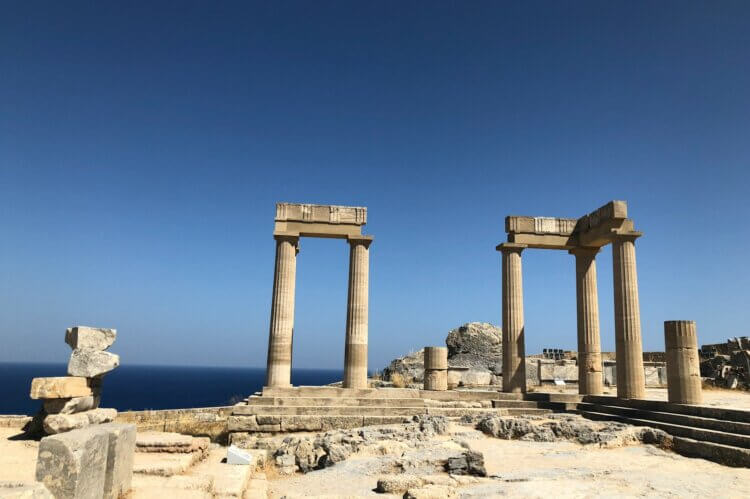 white destroyed towers near sea